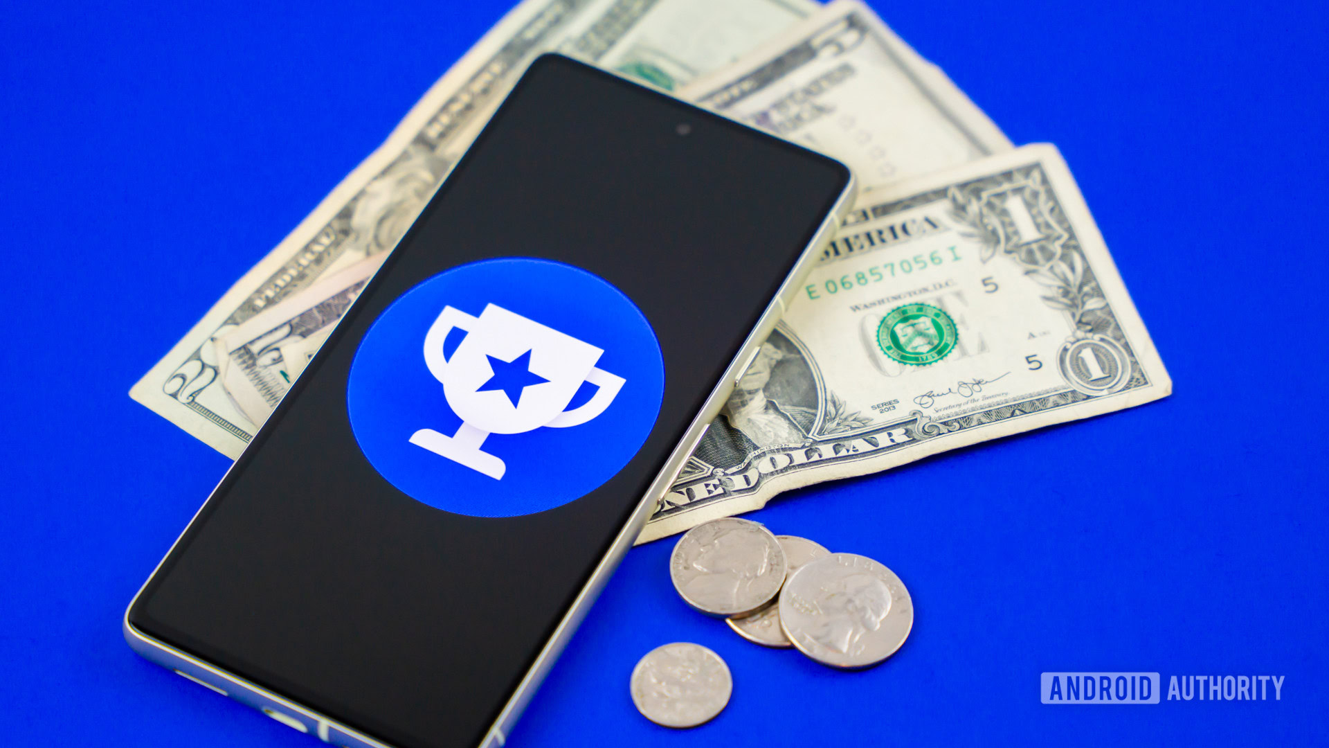 Google Opinion Rewards logo on smartphone next to money Stock photo 2