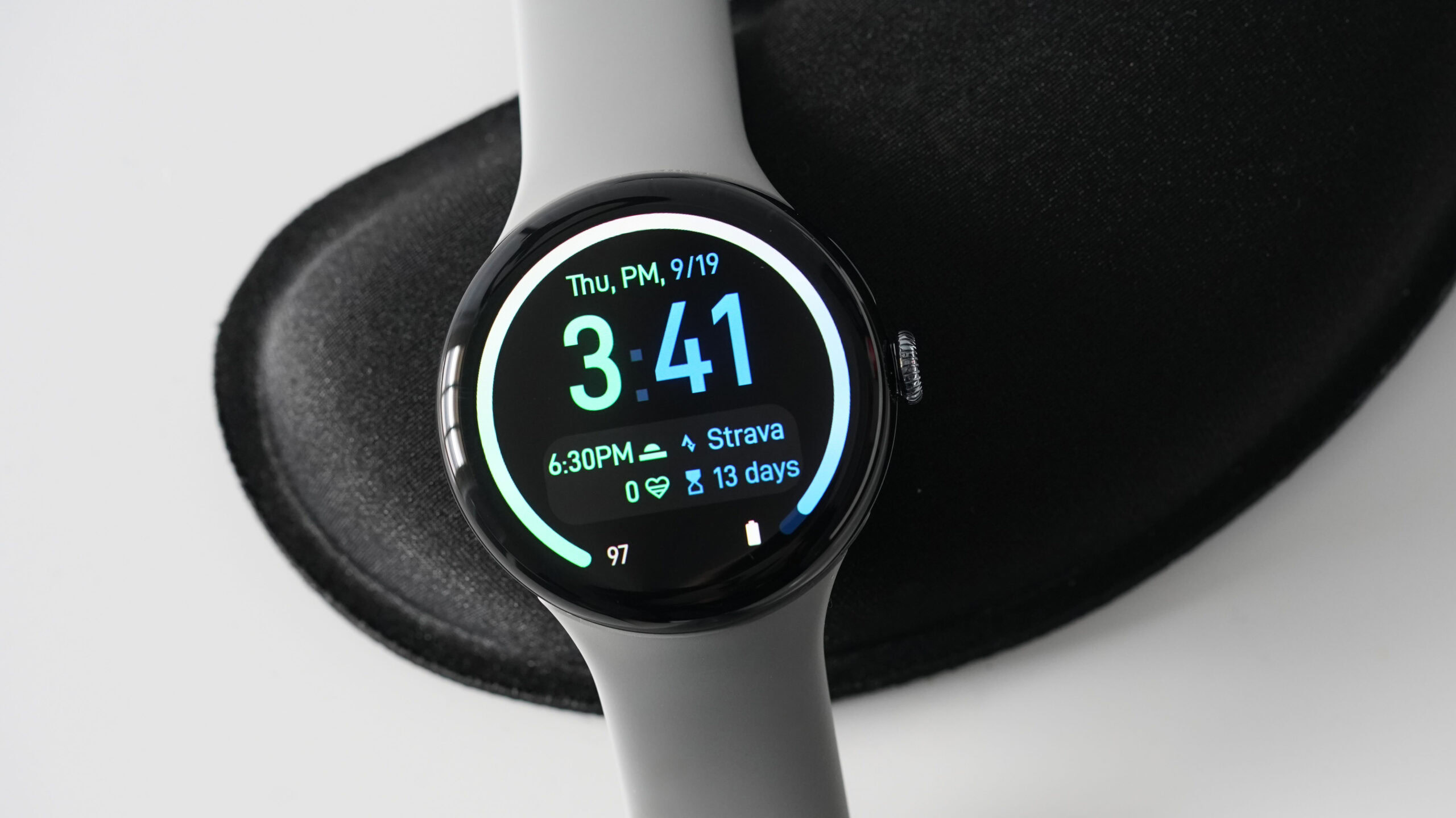 A Google Pixel Watch 3 displays the watch face Dual Tone.