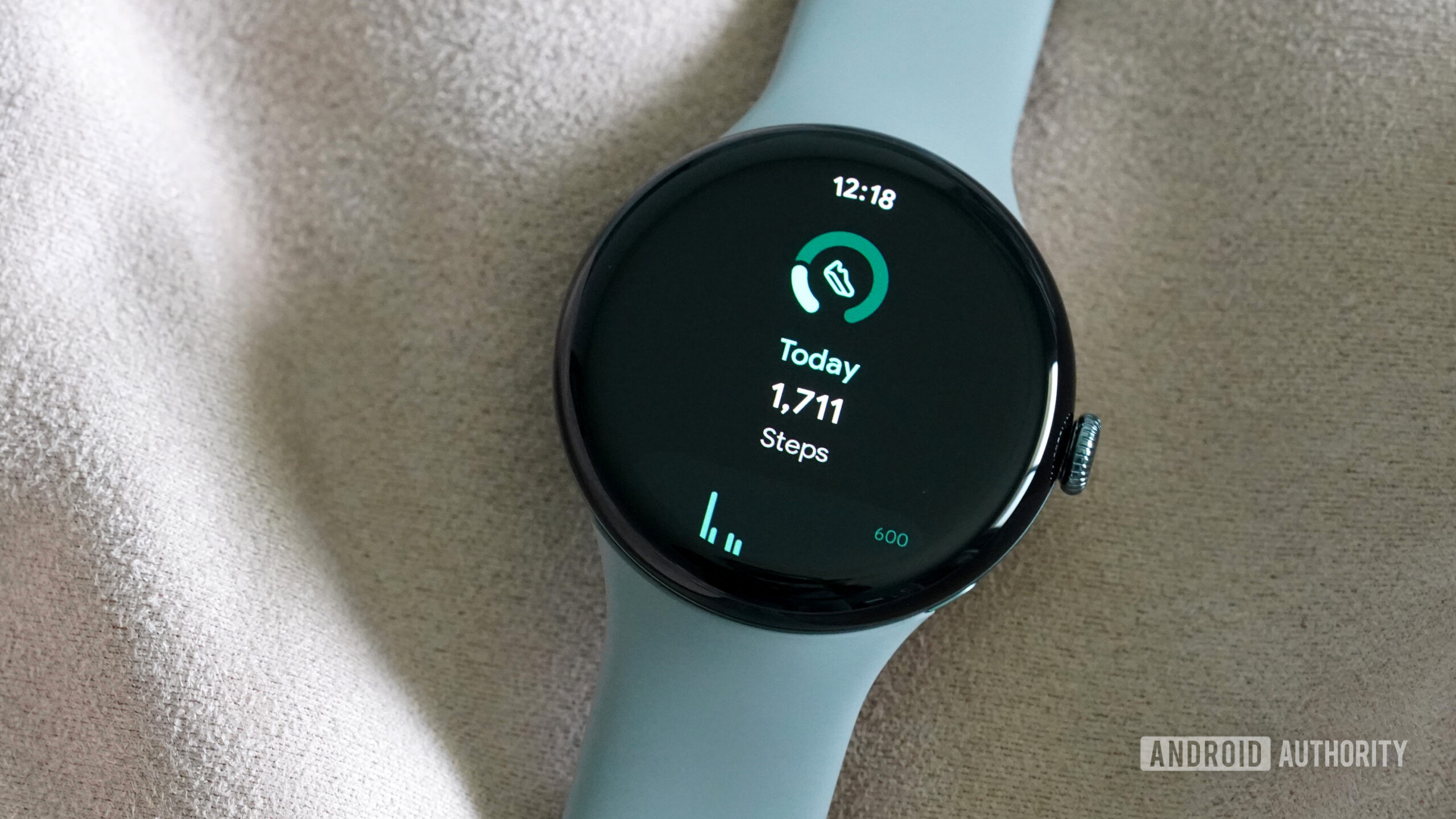 A Google Pixel Watch 3 displays a user's steps.