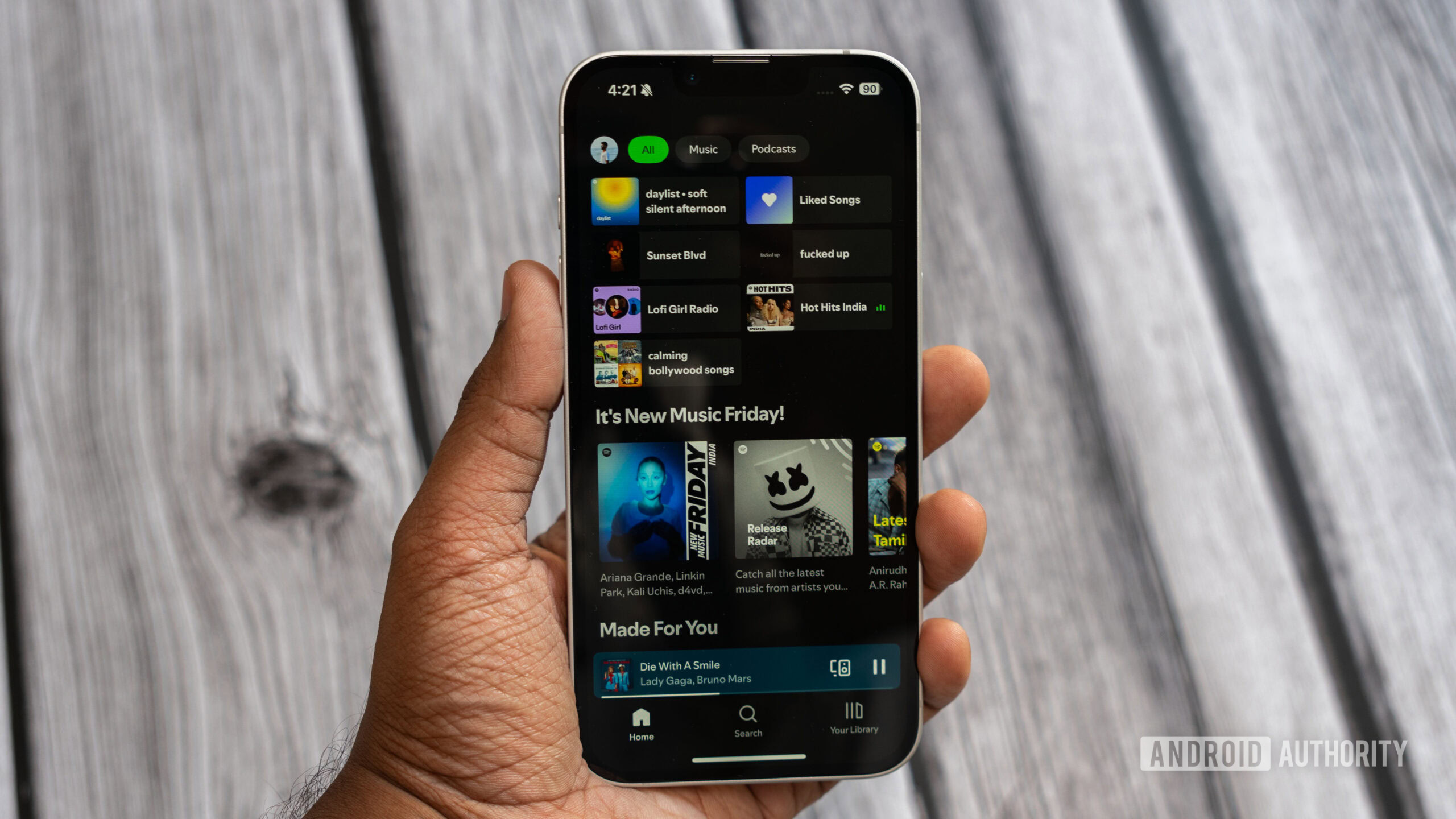 Apple iPhone 16e running Spotify Apple iPhone 16e running Spotify