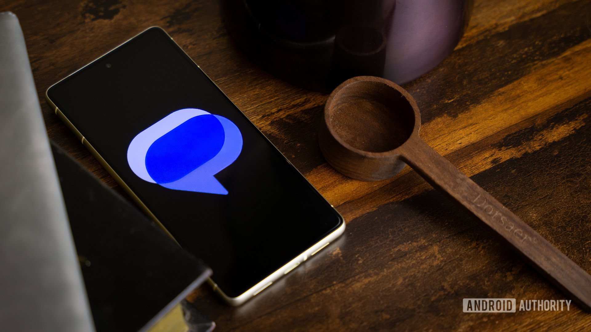Google Messages logo on smartphone laying on table (1) Google Messages logo on smartphone laying on table (1)