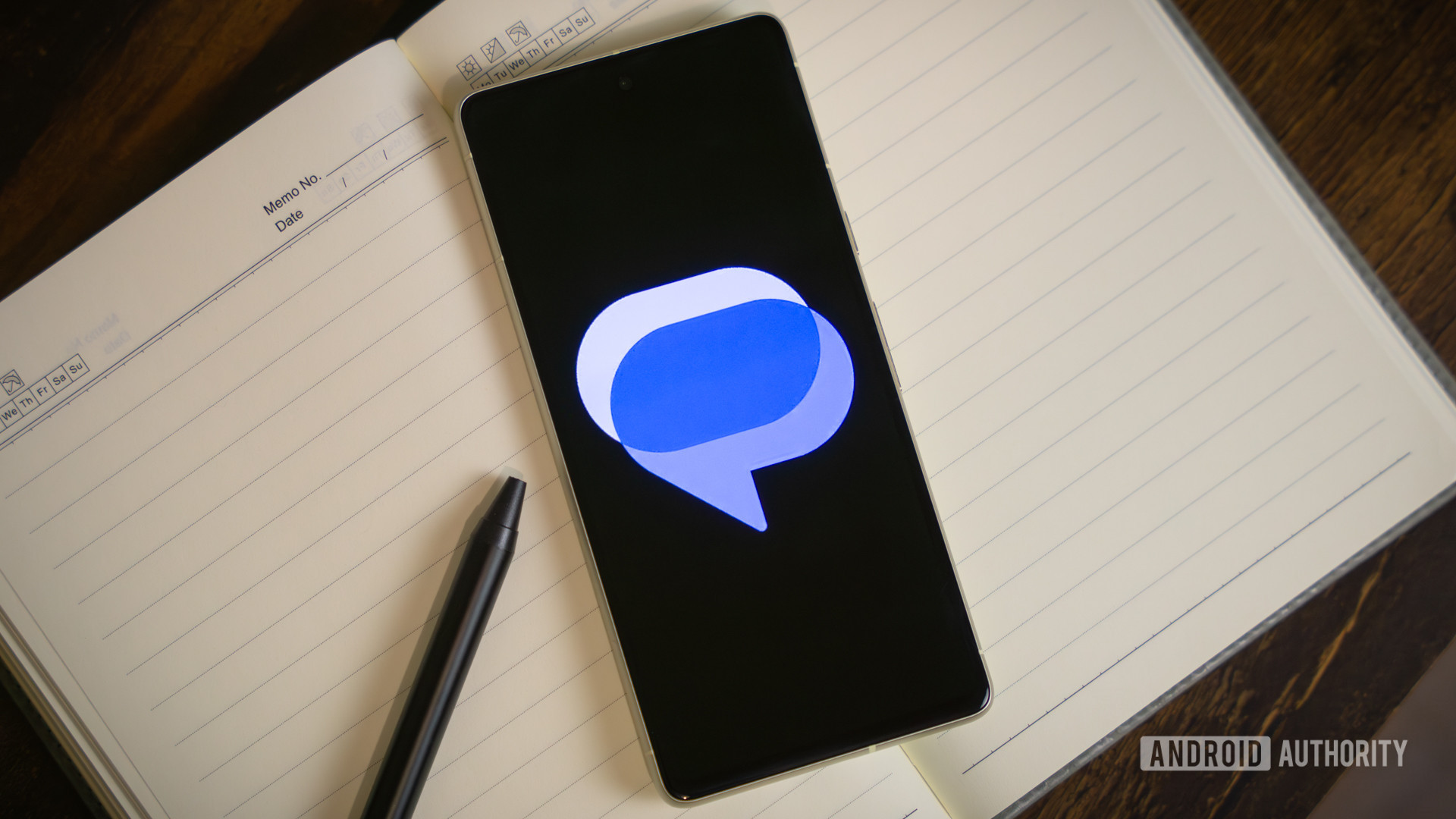 Google Messages logo on smartphone laying on table (4) Google Messages logo on smartphone laying on table (4)