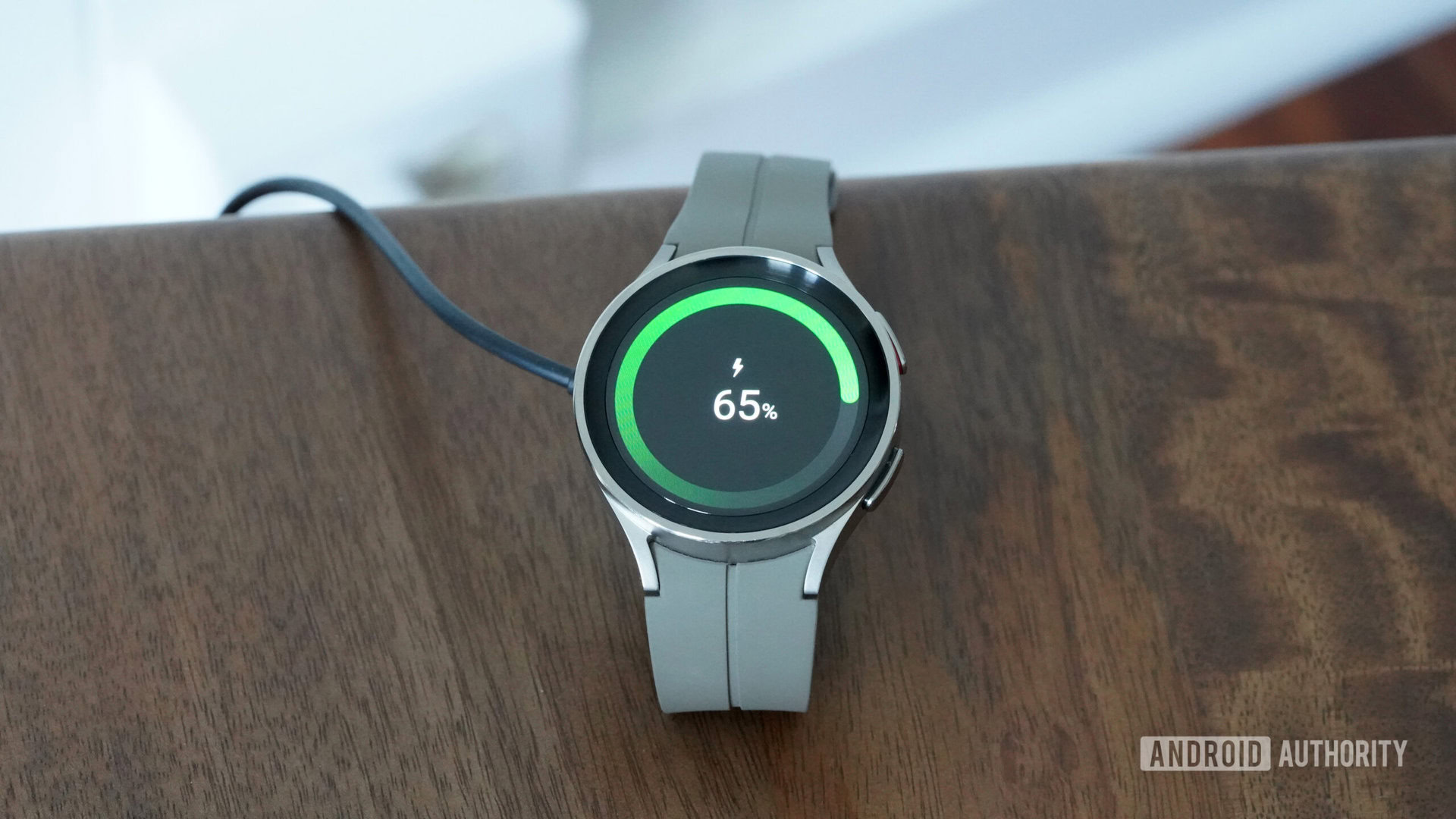 Samsung Galaxy Watch 5 Pro Charging 1 A Samsung Galaxy Watch 5 Pro rests on its charger.