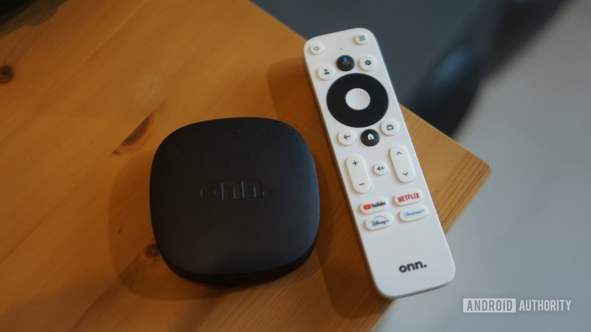 onn 4k box with remote next to it onn 4k box with remote next to it