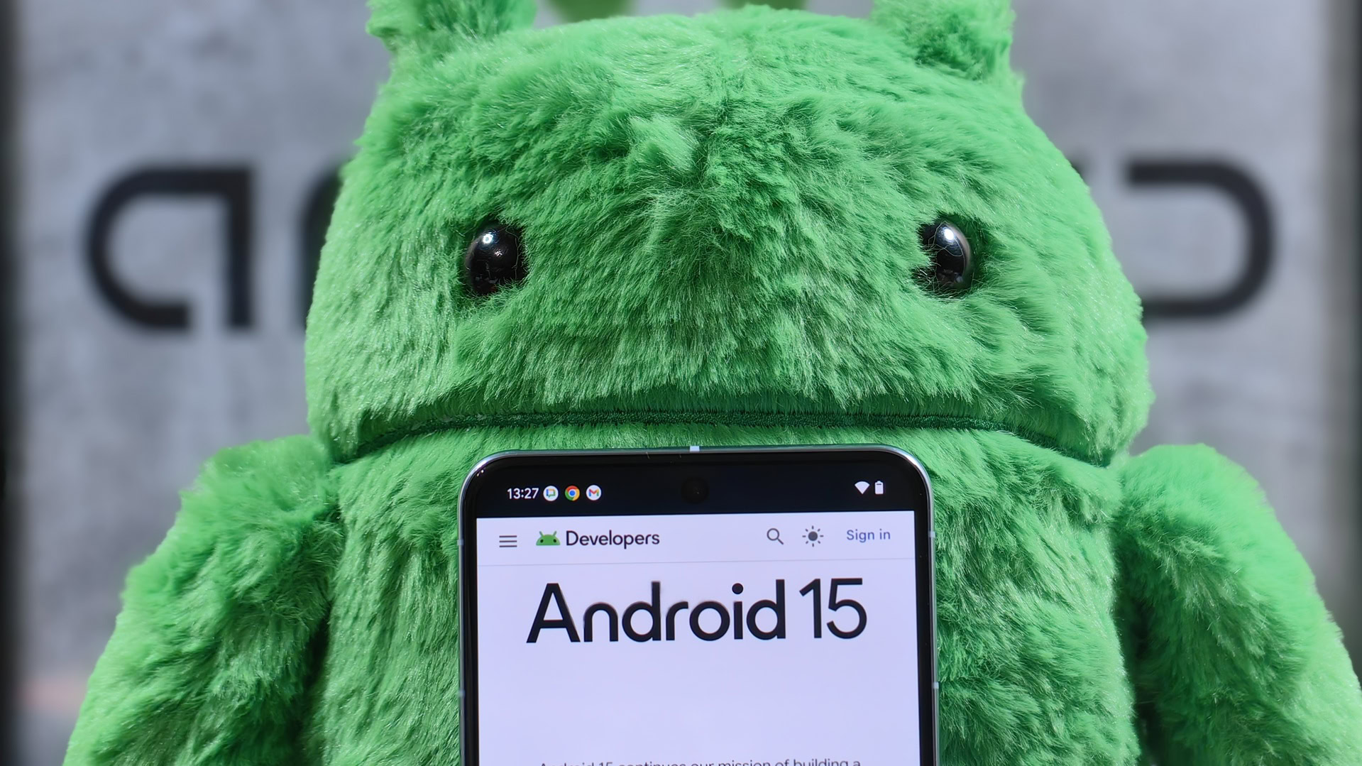 Pixel 8 Pro in front of an Android plushie Pixel 8 Pro in front of an Android plushie