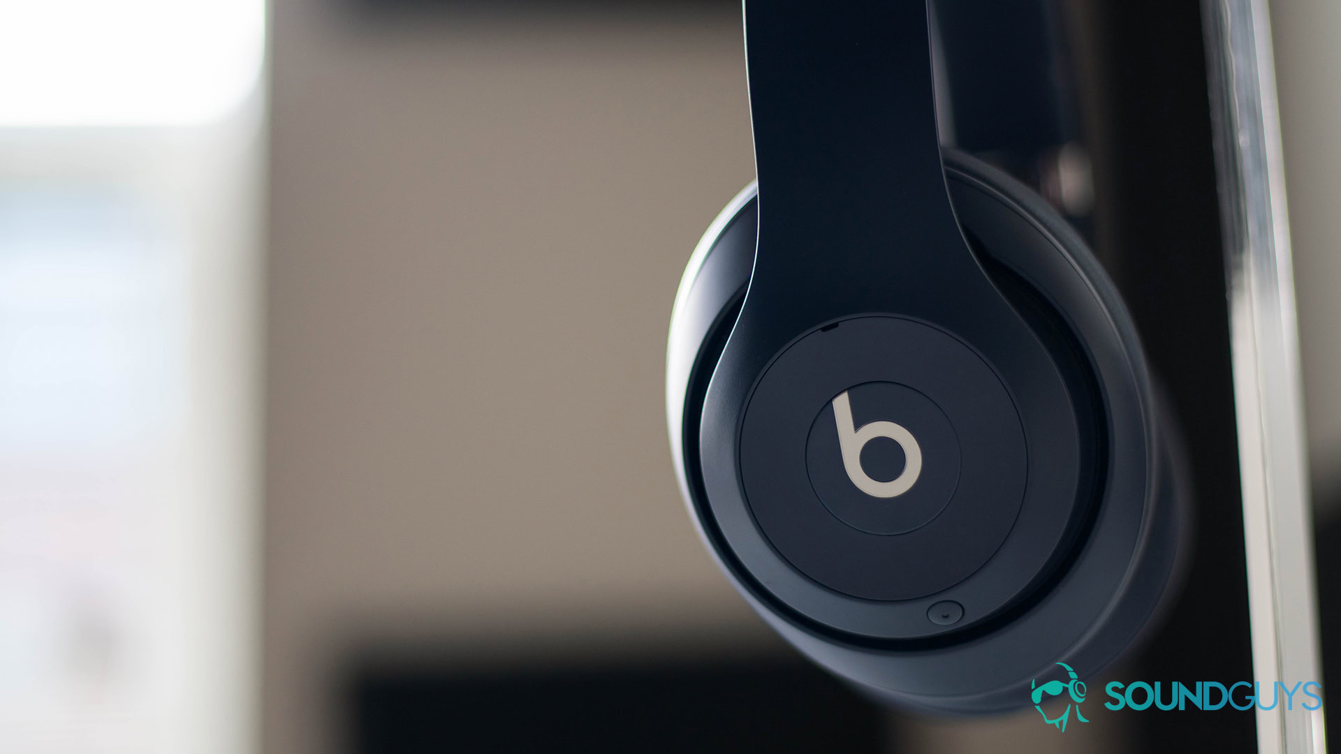 Beats Studio 3 Wireless profile The Beats Studio 3 Wireless rest on a headphone stand in profile.