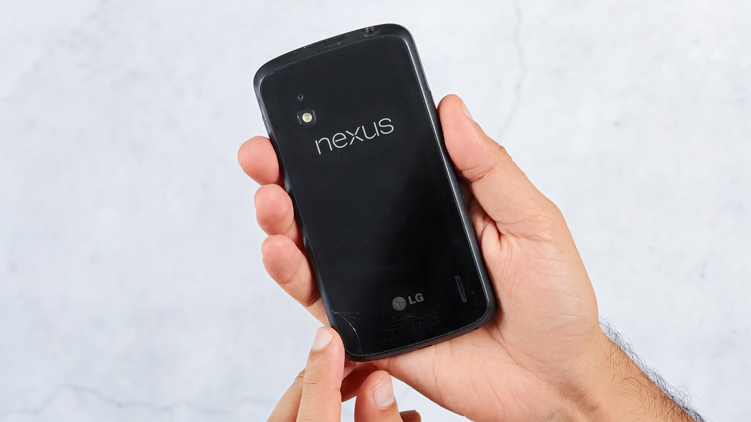 Google Nexus 4 with a cracked glass back Google Nexus 4 with a cracked glass back