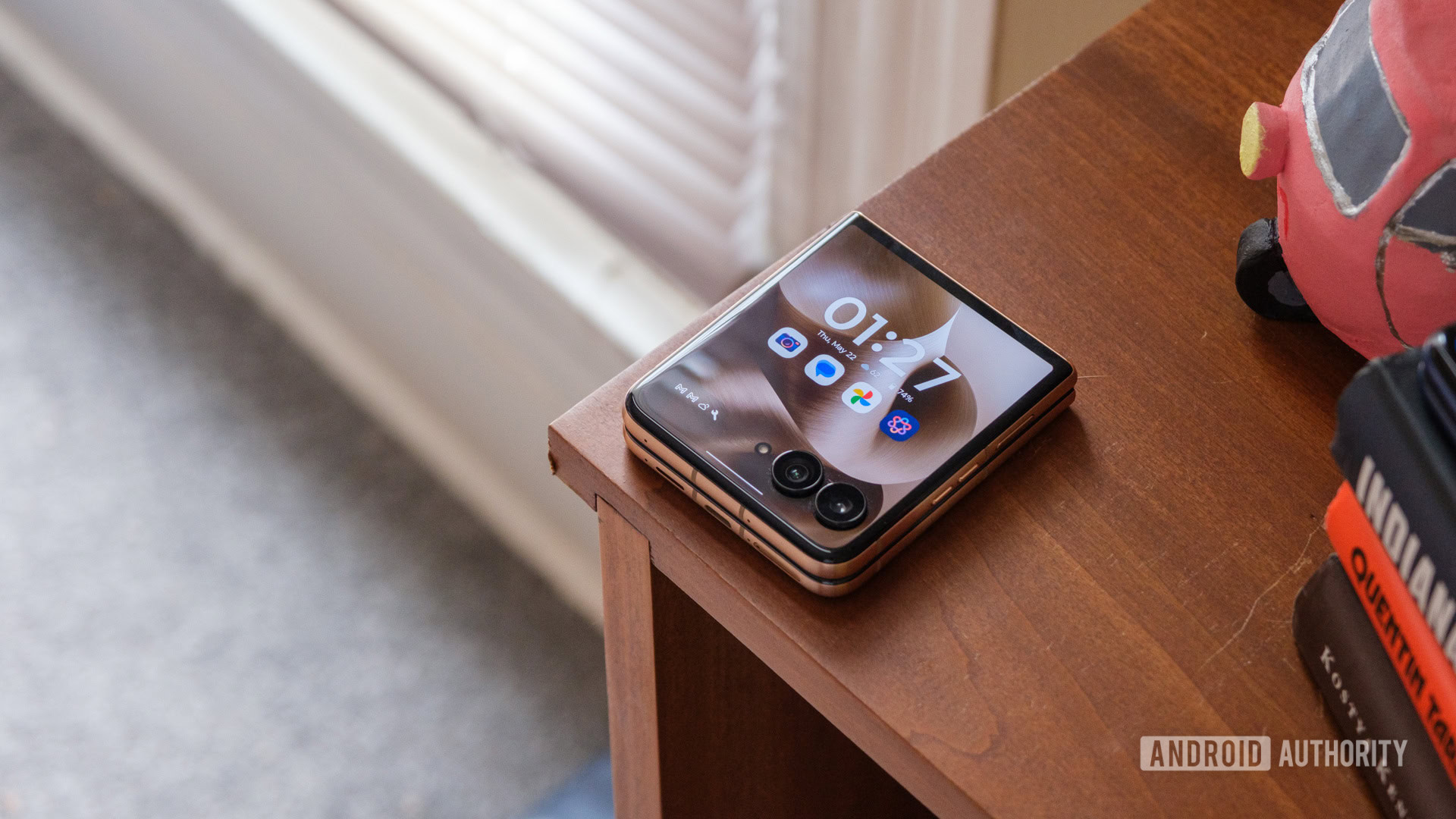 Motorola Razr Ultra on bookshelf