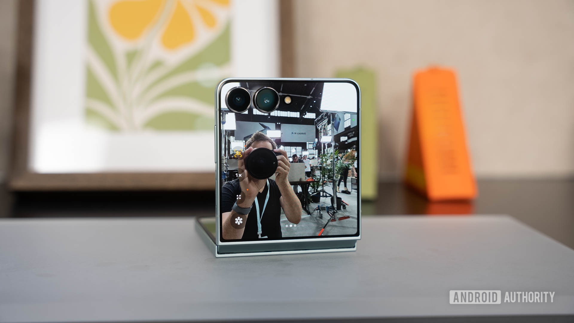 Samsung Galaxy Z Flip 7 propped on table during selfie Samsung Galaxy Z Flip 7 propped on table during selfie