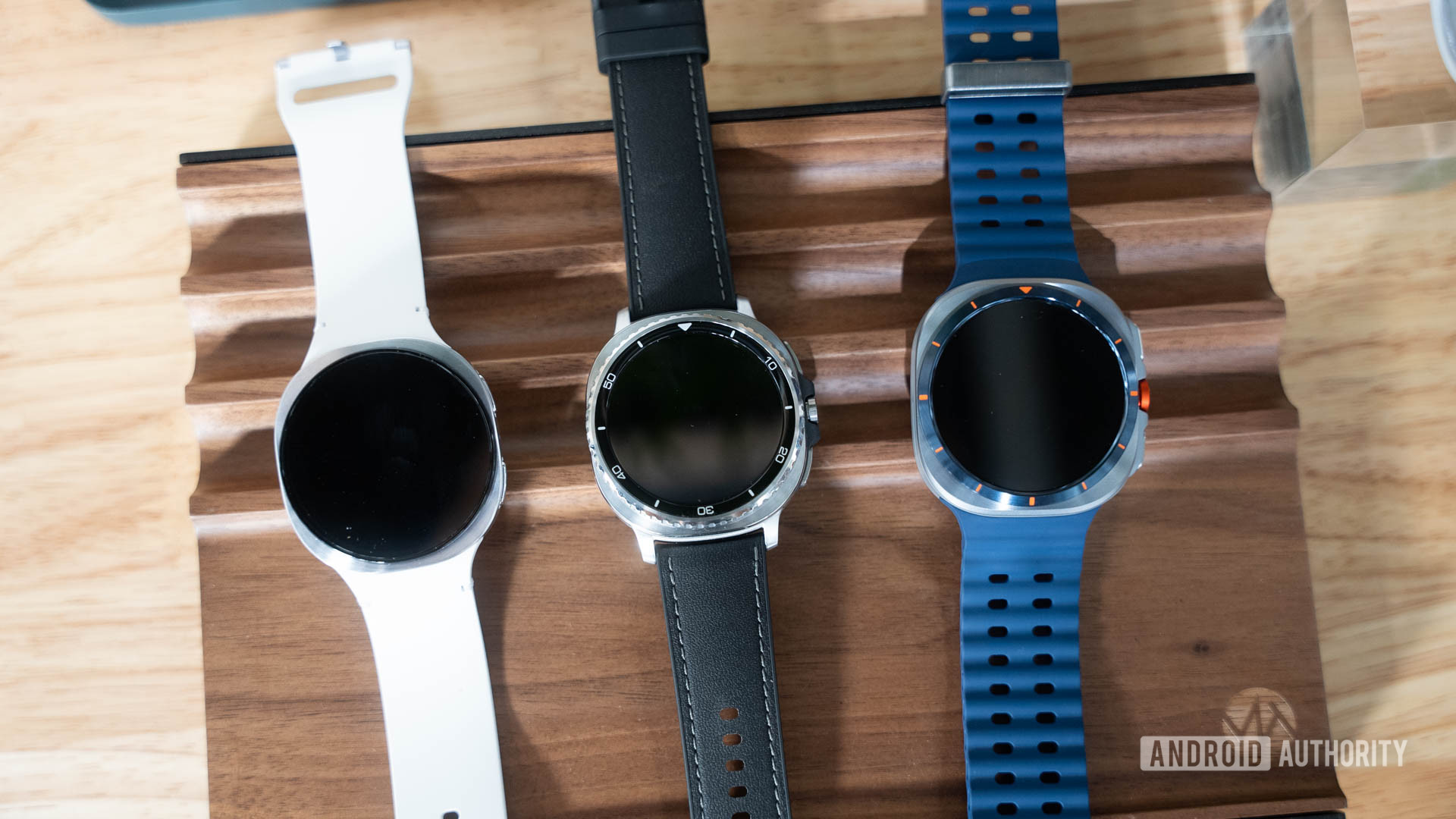 Samsung Galaxy Watch 8 and Galaxy Watch 8 Classic and Galaxy Watch Ultra flat on table Samsung Galaxy Watch 8 and Galaxy Watch 8 Classic and Galaxy Watch Ultra flat on table