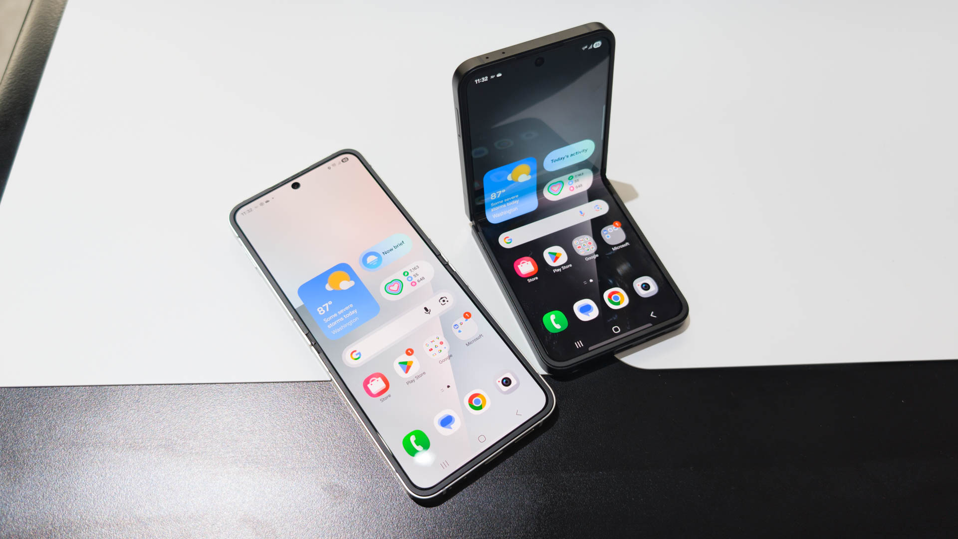 Samsung Galaxy Z Flip 7 FE in both Black and White colorways on table
