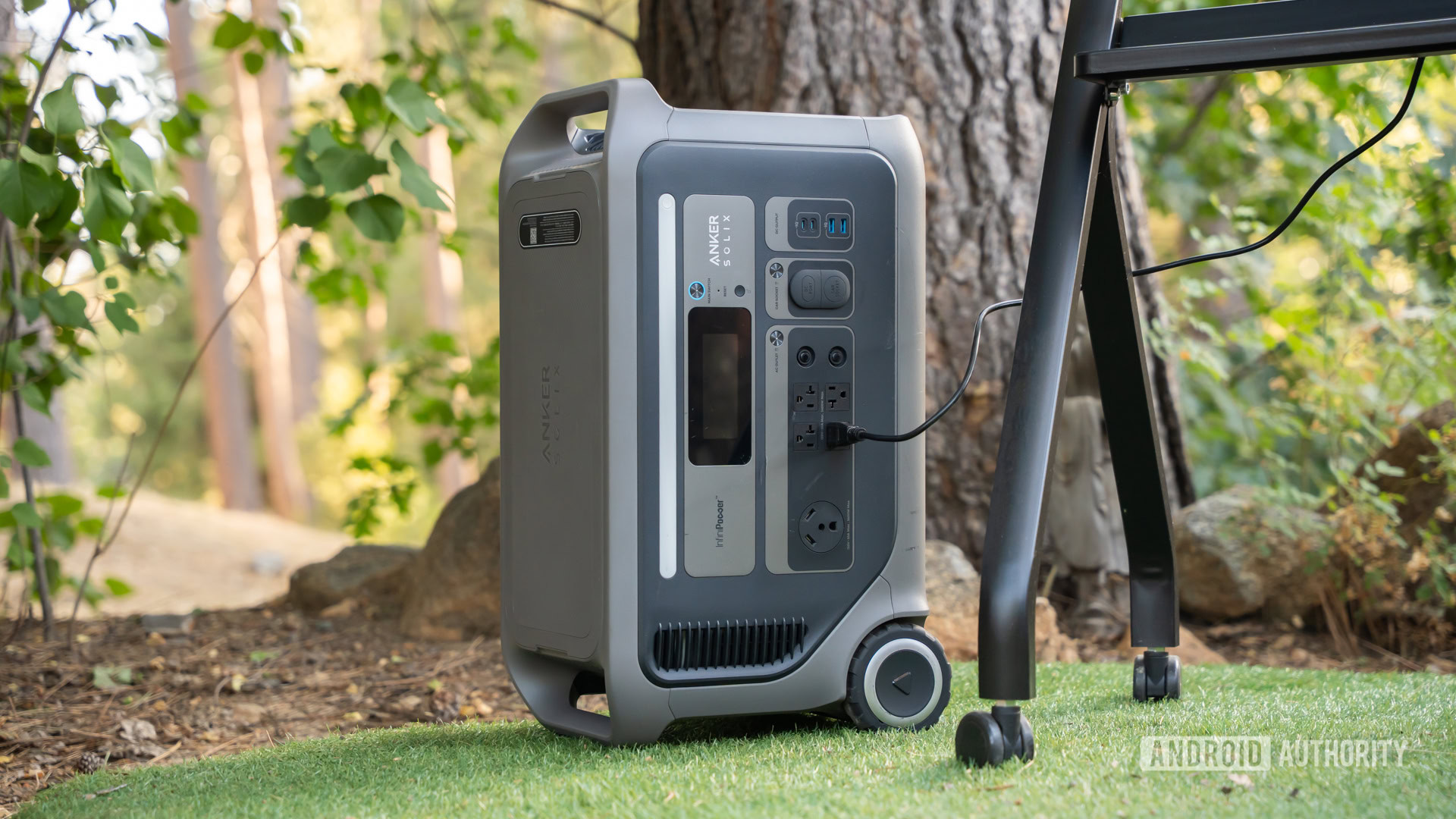Anker SOLIX F3000 Portable Power Station powering TV standing vertically 13