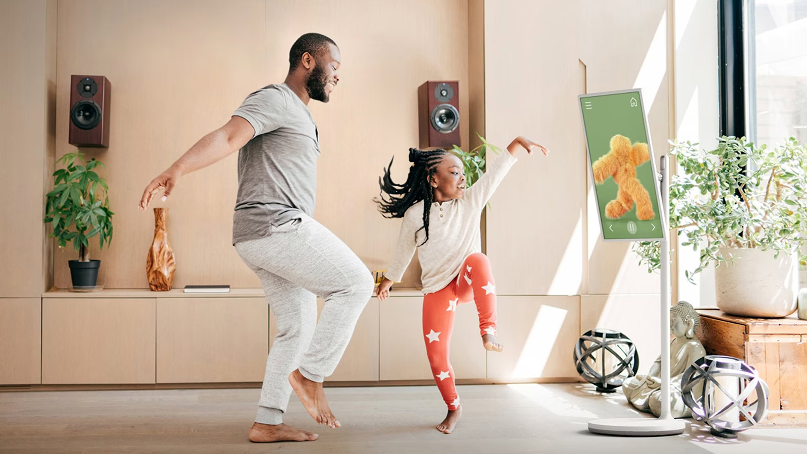 Dad and daughter dancing in front of LG StandbyMe Dad and daughter dancing in front of LG StandbyMe