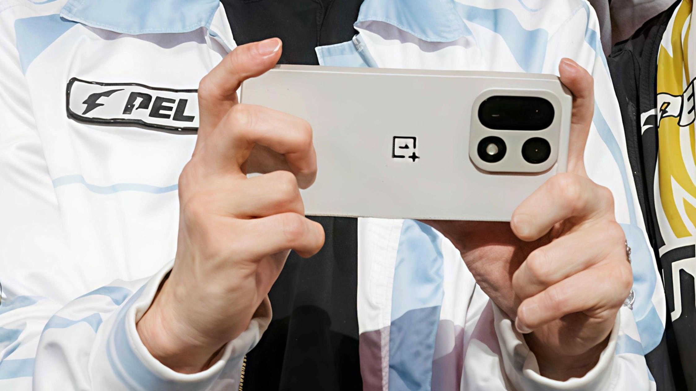 Suspected OnePlus 15 In Titanium Being Used At Event Feature Image