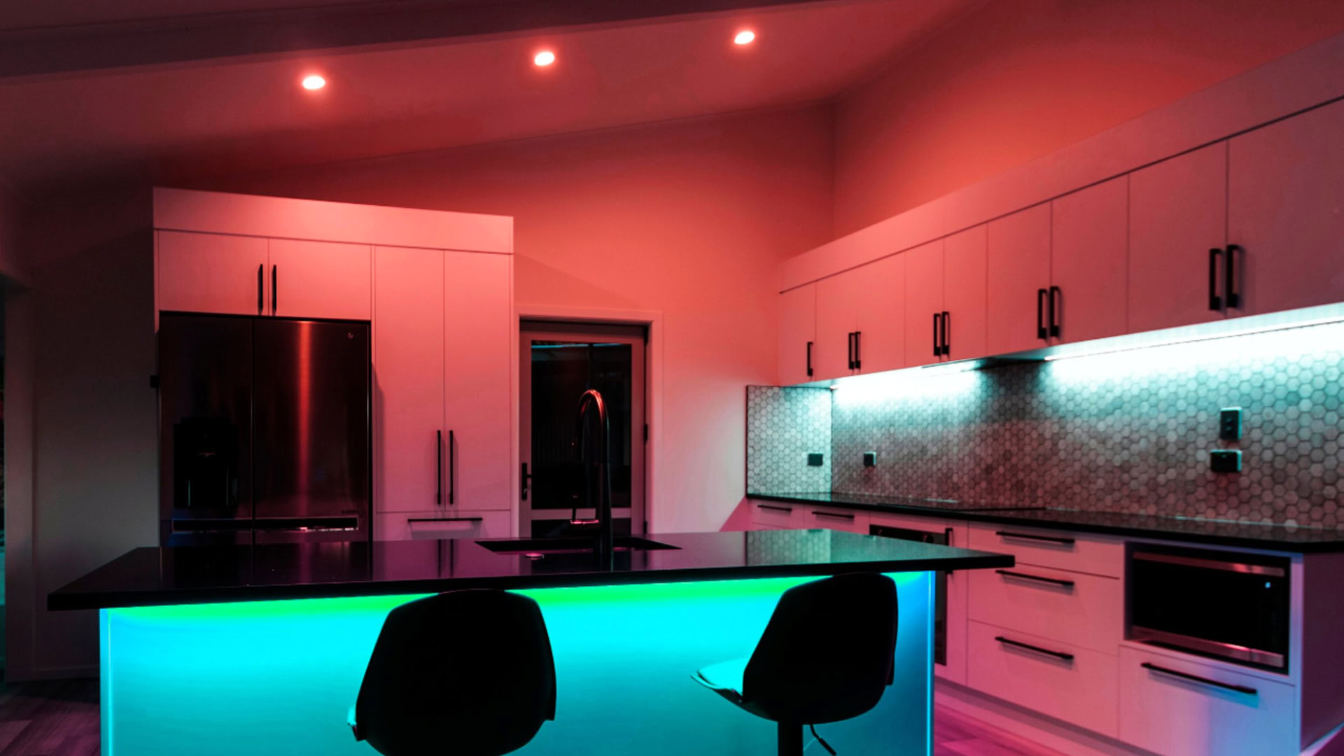 A kitchen lit up with LIFX smart bulbs and lightstrips A kitchen lit up with LIFX smart bulbs and lightstrips