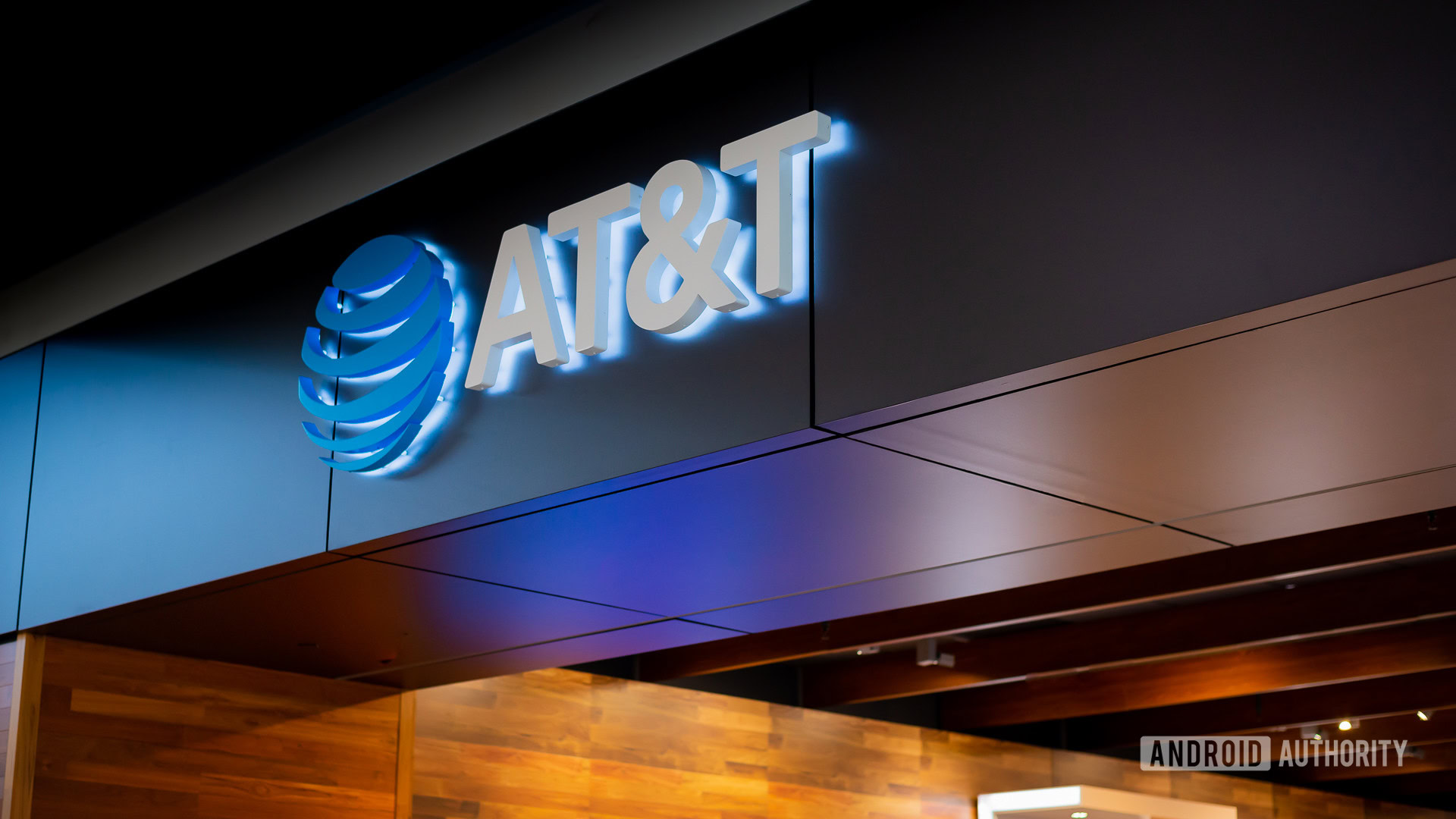 AT&T logo AA An AT&T logo sign displayed in a retail space.