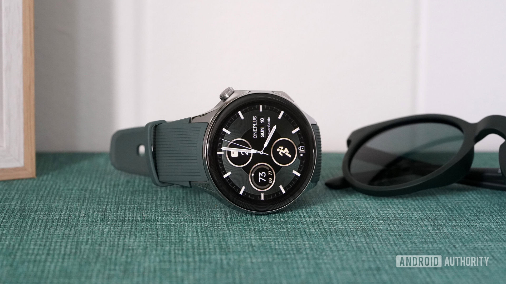 OnePlus Watch 2 Face A OnePlus Watch 2 rests on its side displaying a native watch face.