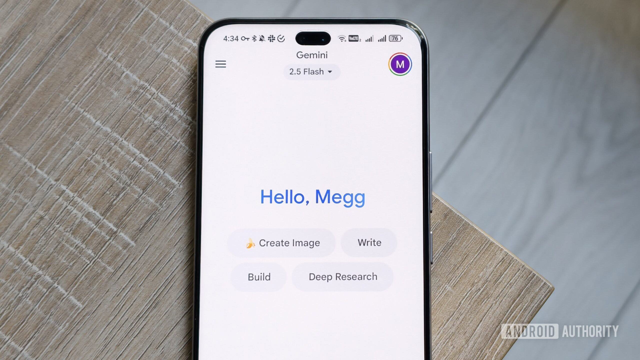 gemini app on a smartphone screen with a greeting gemini app on a smartphone screen with a greeting