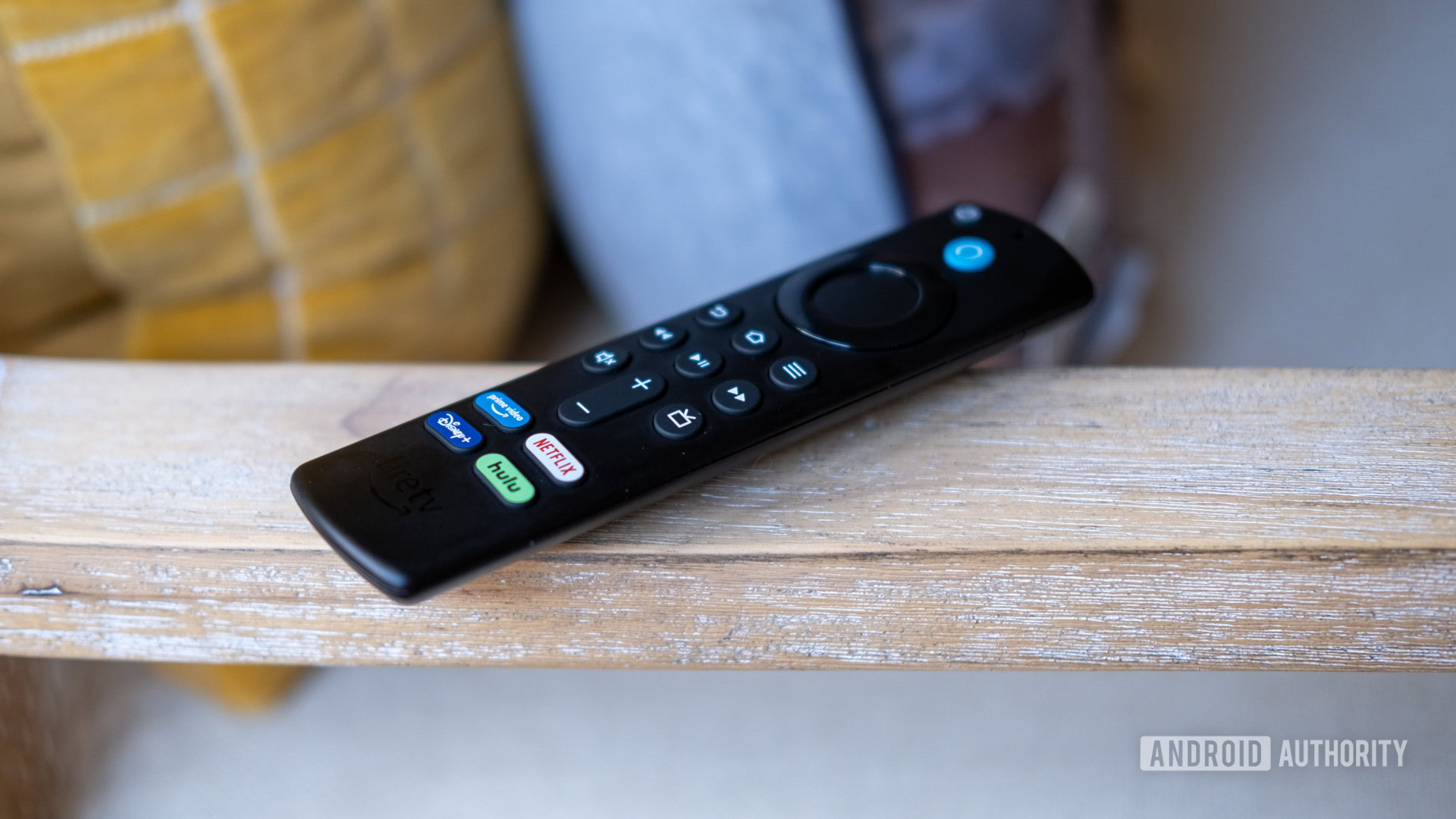 Fire TV Stick 4K Max on chair arm