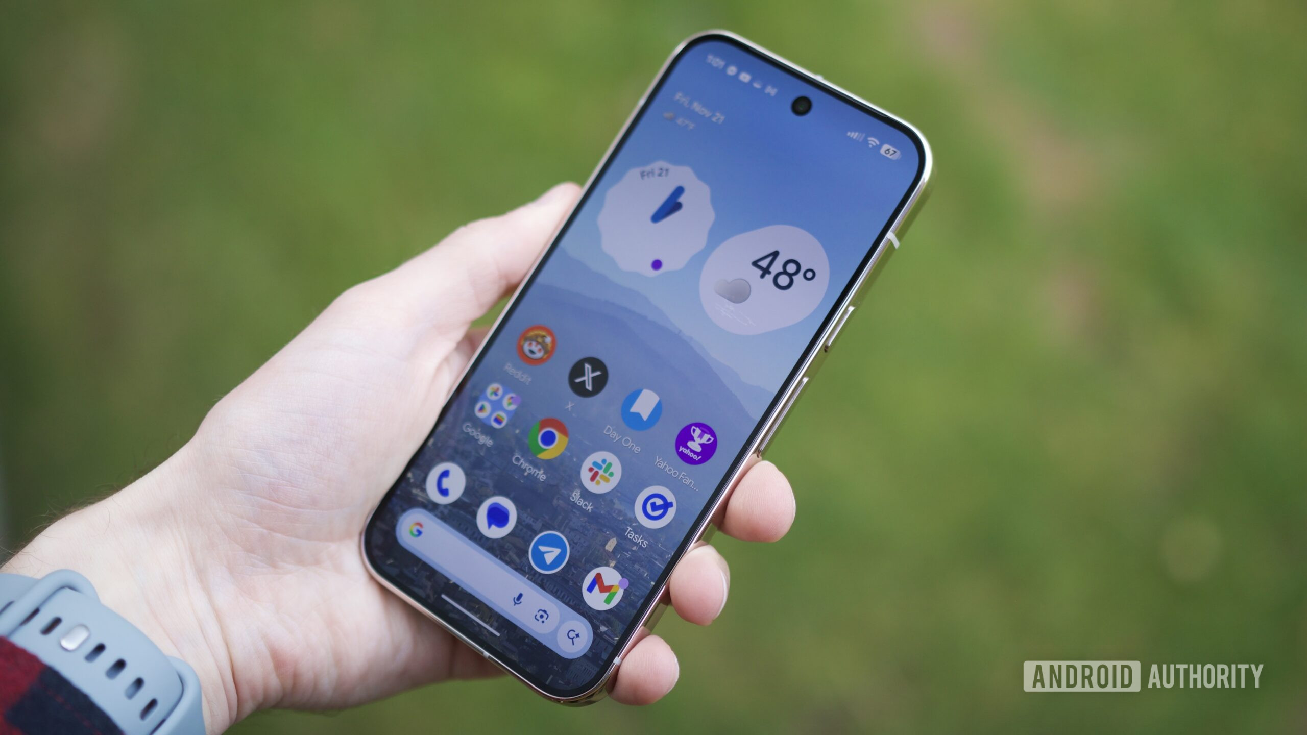 Someone holding a Pixel 10 Pro with its screen on.