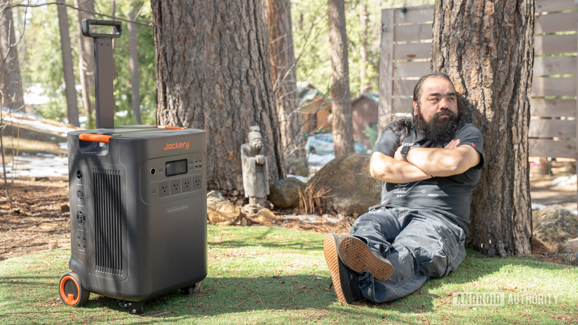 Edgar sitting next to Jackery Explorer 5000 Plus power station 1