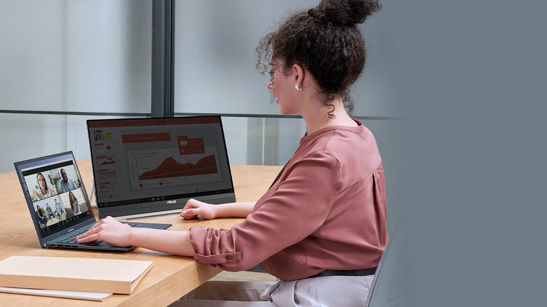 Woman using ASUS ZenScreen 22 inch Portable Monitor on desk