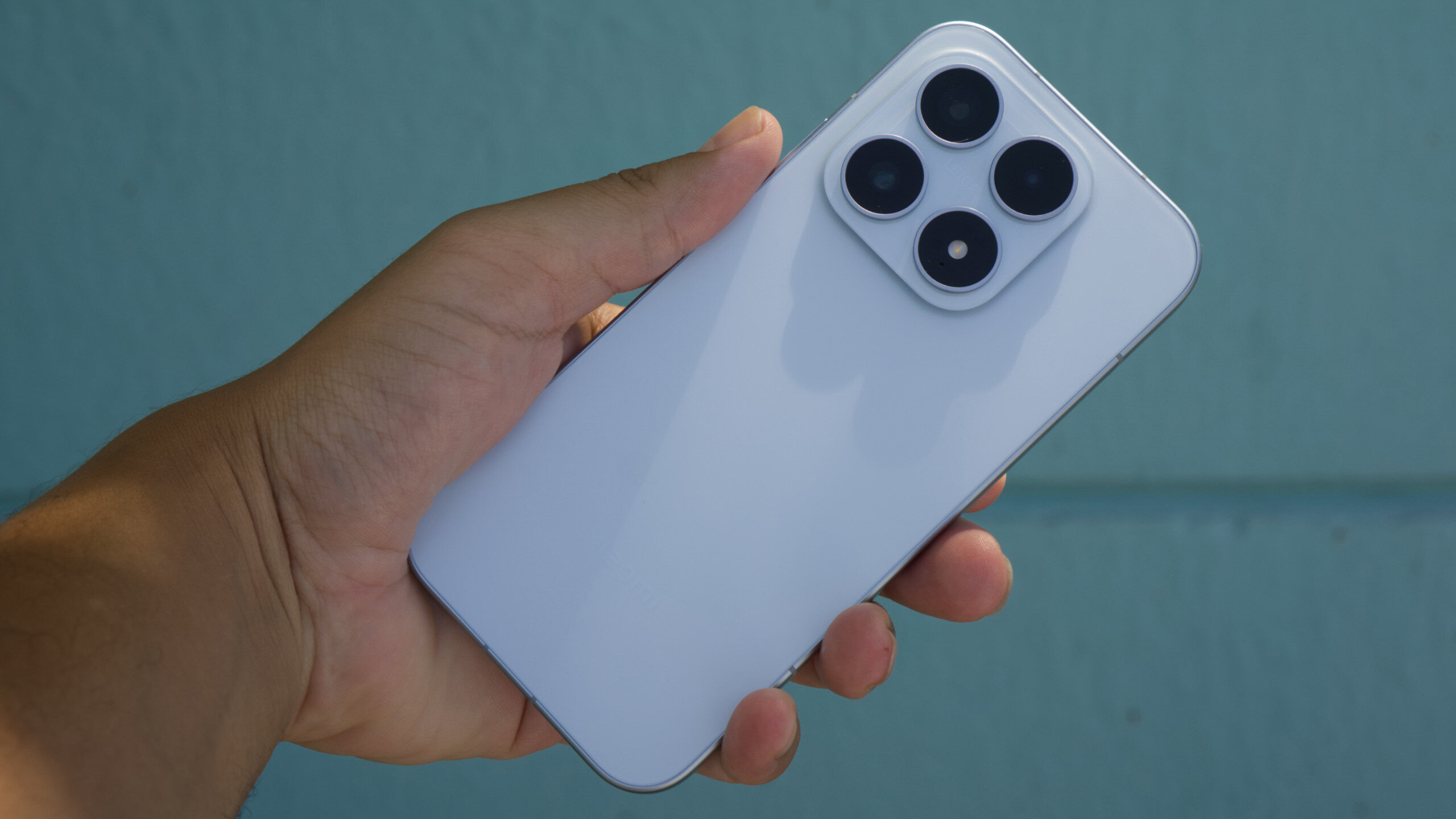 Xiaomi 17 in hand showing back